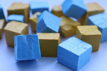 Paint for soy wax in the form of cubes, yellow 
paint, blue paint