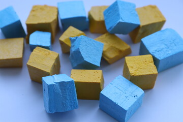 Paint for soy wax in the form of cubes, yellow 
paint, blue paint