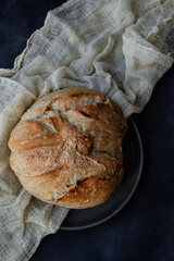 Rustic Artisan Sourdough Bread Loaf on Linen Cloth – Crusty Homemade Bread with Golden Brown Texture, Perfect for Food Bloggers, Bakeries, and Culinary Photography