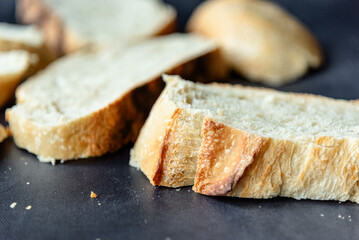 Overhead View of Sliced Artisan Sourdough Bread Arranged in a Pattern – Rustic Homemade Bread with Open Crumb and Golden Crust, Perfect for Food Bloggers and Culinary Design – Sourdough Texture
