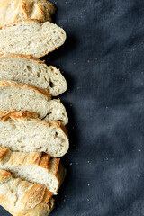 Overhead View of Sliced Artisan Sourdough Bread Arranged in a Pattern – Rustic Homemade Bread with Open Crumb and Golden Crust, Perfect for Food Bloggers and Culinary Design – Sourdough Texture
