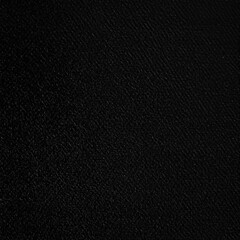 Textured black surface with subtle matte finish patterns