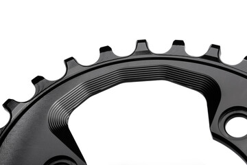Close up of a black oval bicycle chainring against white isolated background. Professional bicycle part.