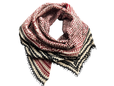 Traditional keffiyeh scarf with intricate black stitching and vibrant patterns in red and white fabric