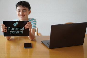 parental control concept. child with devices, laptop, mobile and tablet with security settings