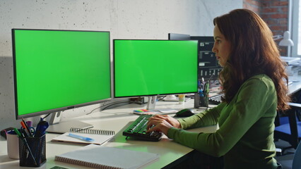 Businesswoman texting mockup pc at work desk closeup. Lady watching two displays