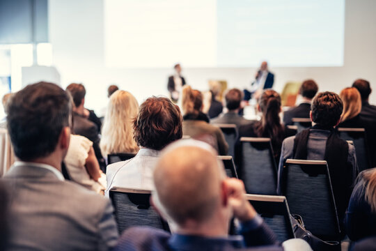 Interview and round table discussion at business convention and presentation. Audience at the conference hall. Business and entrepreneurship symposium.