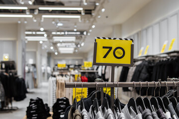 Naklejka premium 70% discount at the clothing store. Soft focus. Clothing sale