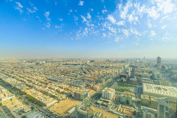 Panoramic view of Riyadh, the capital city of Saudi Arabia, showcasing its vast urban sprawl,...
