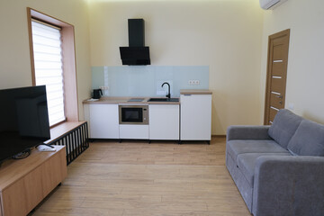 Interior of a studio kitchen in a country hotel room.