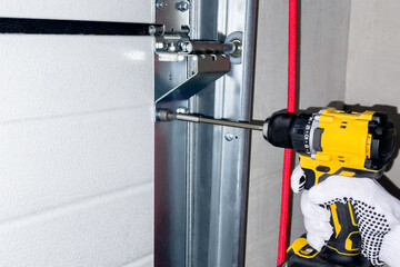 Installation of sectional door rails.