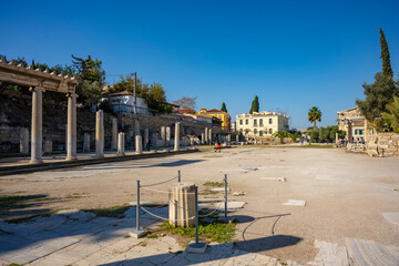 Fototapeta premium The most famous architectural landmarks of ancient greek heritage located in the Plaka district in Athens, Greece: the library of Hadrian, Wind tower, medieval mosque