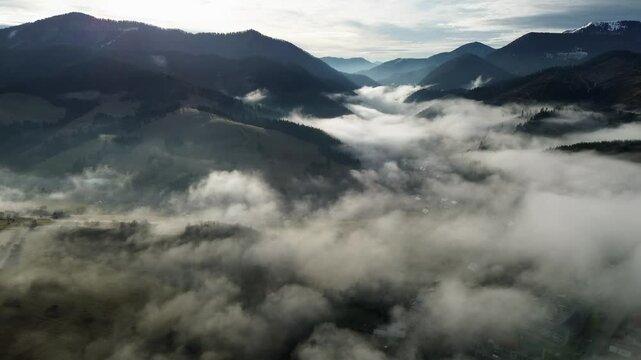 Aerial View of a Beautiful Misty Village in the Valley of the Carpathian Mountains, Slovakia
