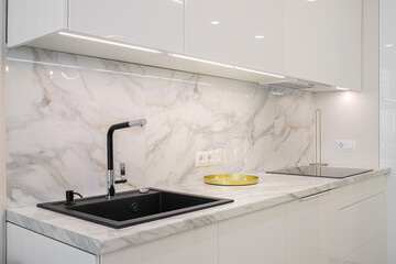 Faucet and granite sink in the kitchen