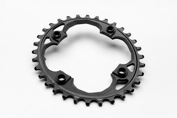 Black oval bicycle chainring against white isolated background, lies flat on the surface....