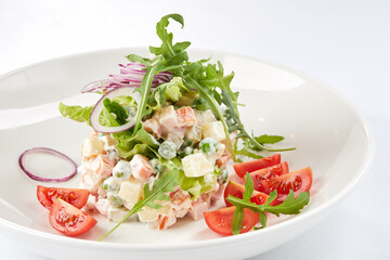 russian salad in the white plate