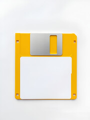 Yellow floppy disk with blank label on white background. Magnetic means of storing information.