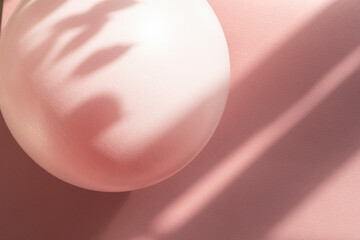 Flat lay of pilates soft pink ball on yoga mat. Abstract fitness background 