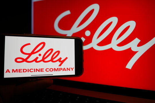 Roosendaal, The Netherlands - March 6, 2025: A mobile phone displaying the logo of Eli Lilly and Company, with the company logo in the background in red.
