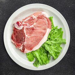 Pork on bones raw meat fresh tasty food dish delicious gourmet food background on the table rustic food top view copy space