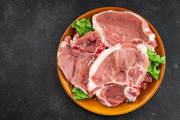 Pork on bones raw meat fresh tasty food dish delicious gourmet food background on the table rustic food top view copy space