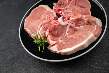 Pork on bones raw meat fresh tasty food dish delicious gourmet food background on the table rustic food top view copy space