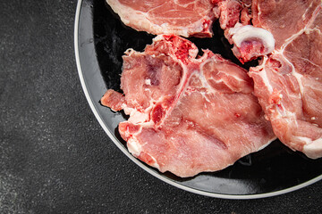 Pork on bones raw meat fresh tasty food dish delicious gourmet food background on the table rustic food top view copy space