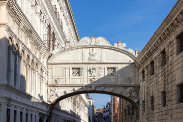 View of Bridge of Sighs from stone bridge Ponte della Paglia, Venice, Italy