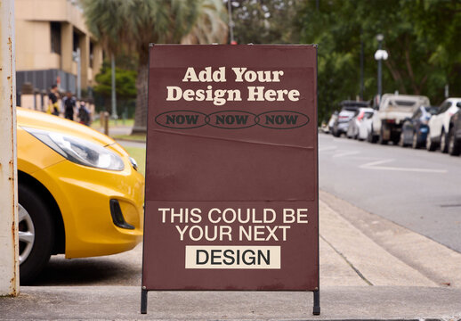 Blank A-frame Sign on the Sidewalk of a Busy Street in Sydney, Australia, Indicating Local Urban Activity and Commerce