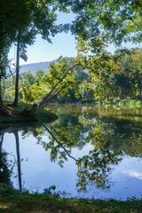 a public place leisure travel landscape lake views at Ang Kaew Chiang Mai University and Doi Suthep nature forest Mountain views spring cloudy sky background with white cloud.