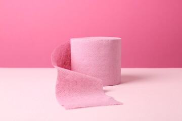 Color toilet paper roll on pink background