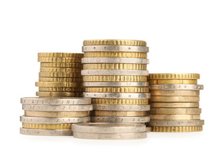 Stacks of different coins isolated on white
