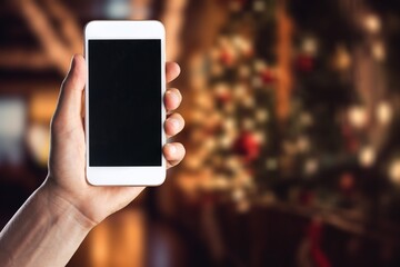 mobile phone with blank screen and Christmas  background.