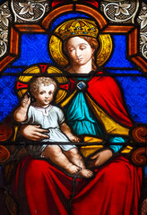 Fototapeta premium 2025-01-26, Église Saint Marc - Orléans, FRANCE. Stained glass (19th century) of Blessed Virgin Mary holding baby Jesus Christ in her arms. .