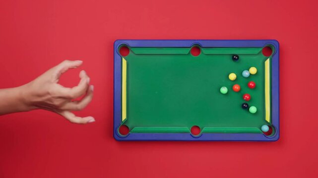 4K Overhead Shot of Hand Striking Billiard Ball with Cue Stick &ndash; Precision in Motion