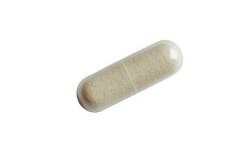 White capsule filled with powder resting on a clean surface in a well-lit setting