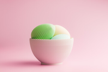 Easter decoration. Colorful eggs in bowl on pink background.
