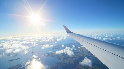 Airplane Wing Above Coastal Cloudscape Sunlit Scene