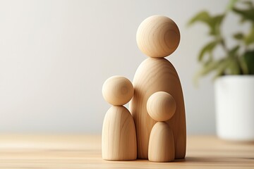 top view of wooden figure of mother with children, demographics concept, abstract
