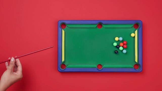 4K Overhead Shot of Hand Striking Billiard Ball with Cue Stick &ndash; Precision in Motion