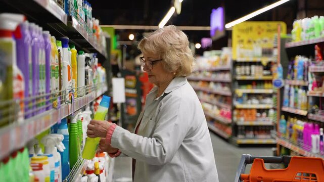 Senior Woman Buying Detergent in Supermarket