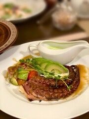 Grilled octopus with avocado 