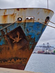 Rusty ship moored at port