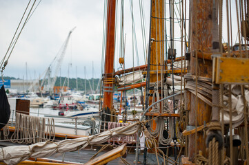 detailed view of wooden sailboat mast and ropes.