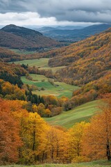 Naklejka premium Breathtaking view of autumn mountainscape with colorful trees, clear sky and winding roads.