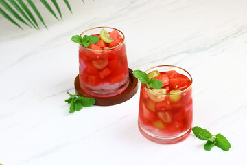 Refreshing mix fruits ice with coconut, watermelon, grapes and red syrup. Iftar drink for ramadan month in Indonesia.