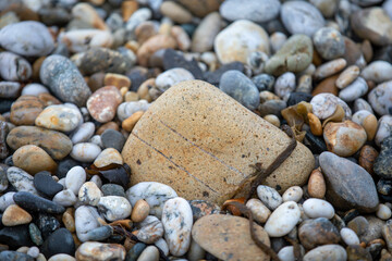 Rocks and pebbles along Marazion Beach in Cornwall, UK.
