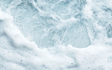 White Sea Foam Texture on Light Blue Ocean Background