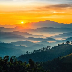 Fototapeta premium Sunrise Over Misty Mountain Range with Forest and Orange Sky