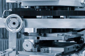 Manufacturing machine with control handles and gear transmission, industrial concept background